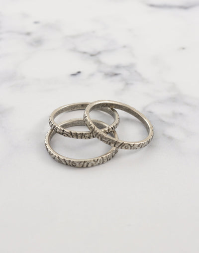 Pewter stacking rings on marble