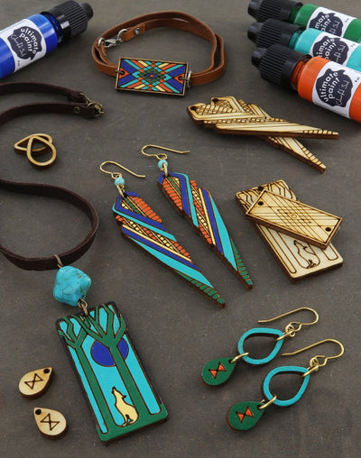 Jewelry & patina test on wood with colorful designs